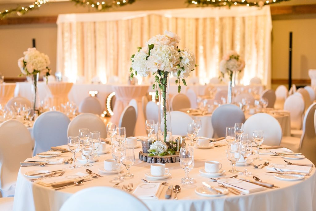 Elegant tall table setting with white flowers