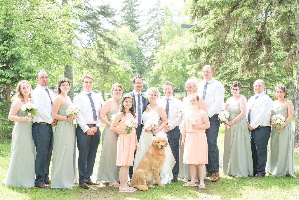 Wedding Party in pink and grey pose for picture at Vickers Park