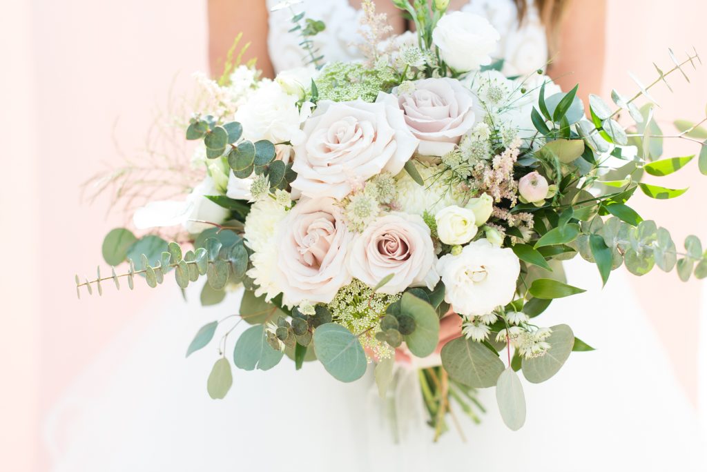 Soft and feminine bouquet made with quicksand roses and eucalyptus