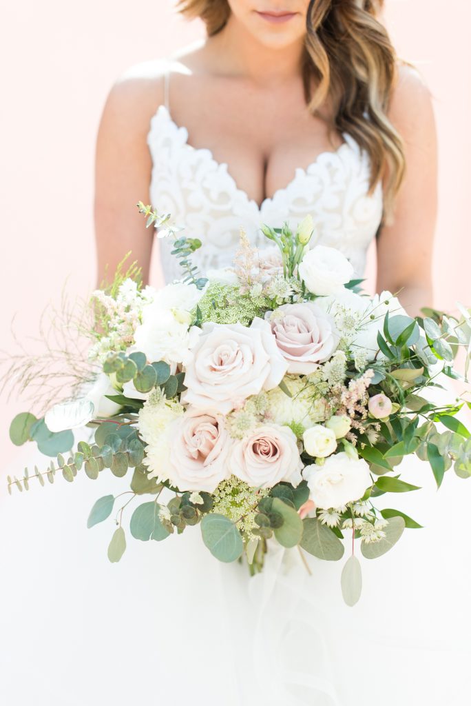Soft and feminine bouquet made with quicksand roses and eucalyptus