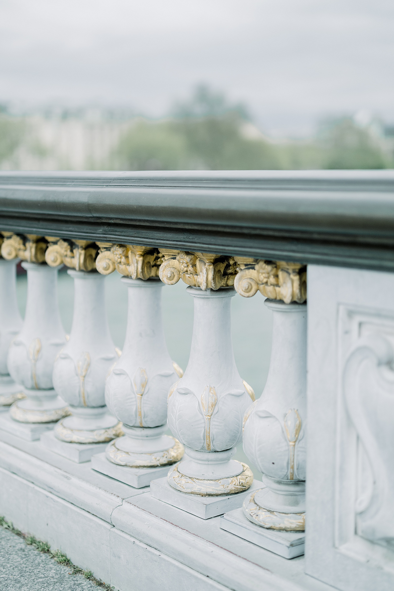 A close up of the details on the pont alexandre iii featuring gilded details