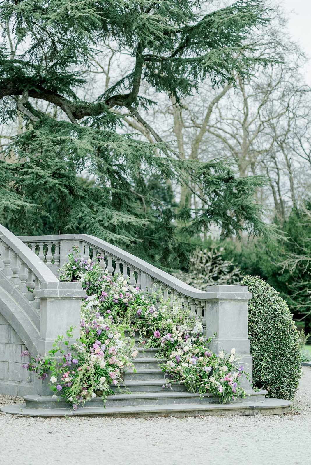 Flower lined staircase at wedding at Chateau Bouffemont